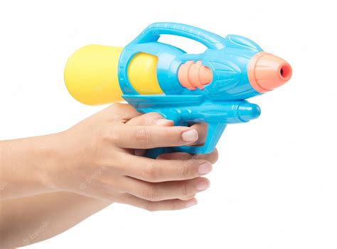 Premium Photo | Gun water toy on hand isolated on a white background