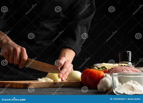 Chef, Chef Preparing A Dish, Chopping Onions. Stock Photo - Image of ...