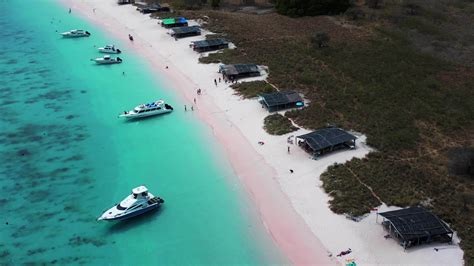 Aerial orbiting view of pink beach in Komodo 30469400 Stock Video at ...