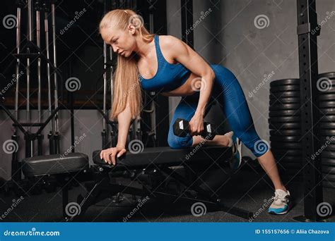 Slim Well-built Girl Lifting Weights in the Sport Center Stock Photo - Image of body, action ...