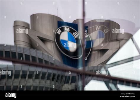 21 March 2018, Germany, Munich: Car company BMW's logo looms large on the facade of the BMW ...