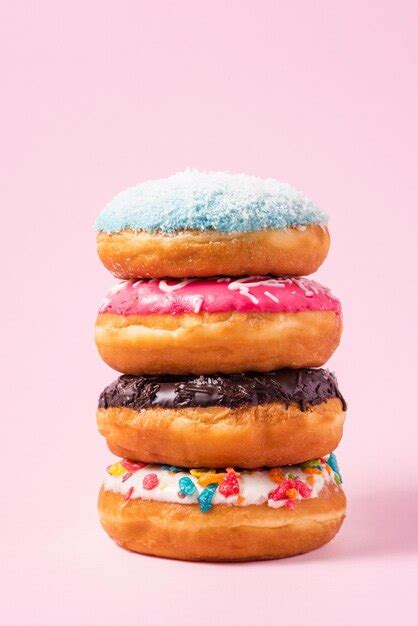 Premium Photo | Delicious donuts for birthday on pastel pink background