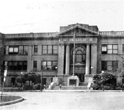 an old black and white photo of a large building with columns on the ...