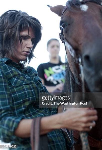 Kristi Noem saddles her horse before checking fences and cattle on ...