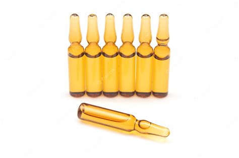 Premium Photo | Seven medical glass ampoules for injection drug on a white background