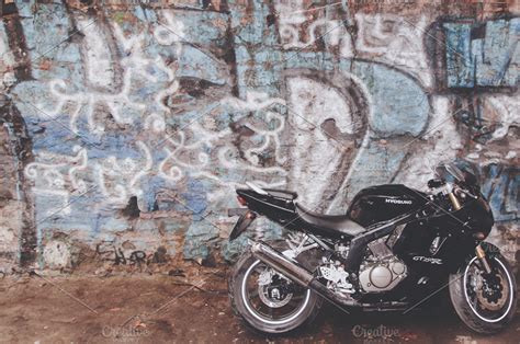 Motorcycle and Graffiti Wall ~ Transportation Photos ~ Creative Market