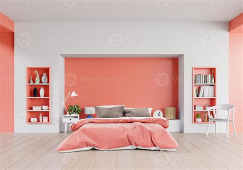 Living coral color bedroom of luxury house with double bed and shelves with living coral color ...