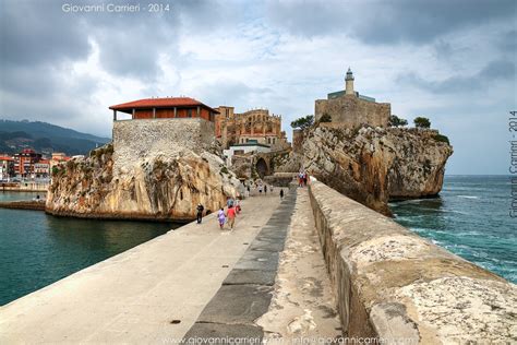 The landscape seen from the harbor, the lighthouse and the Church of Castro Urdiales