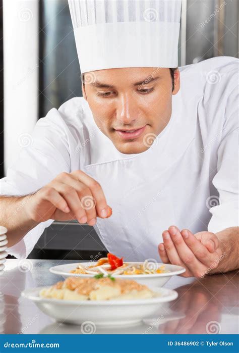 Chef Sprinkling Spices on Dish Stock Photo - Image of male, adult: 36486902