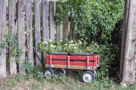 Little Red Wagon of Flowers in Garden Stock Image - Image of wagon ...