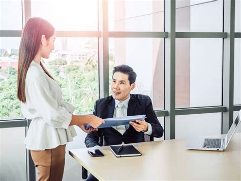 Asian Businessman, Boss Working with Young Woman Secretary on Desk in ...