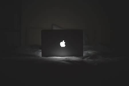 Royalty-Free photo: B&W MacBook Glowing Apple Logo | PickPik