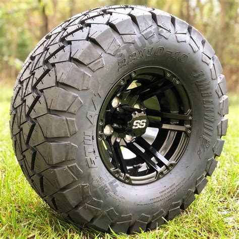 an off - road vehicle tire on the grass