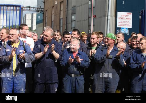 Ship yard workers clap as the coffin of former Glasgow shipyard union leader Jimmy Reid passes ...