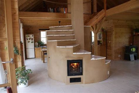 a living room filled with furniture and a fire place next to a spiral ...