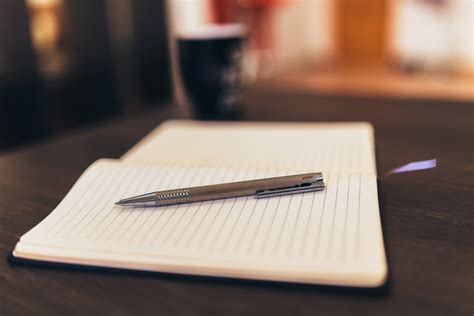 Pen on Notepad Paper · Free Stock Photo