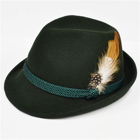 Green felt hat with a brown feather. Imported from Germany.