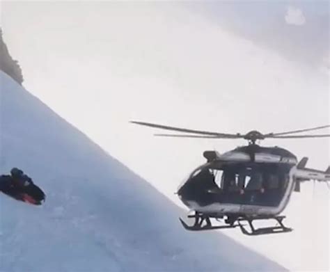 Moment helicopter saves skiers stranded at 7,400ft in French Alps ...