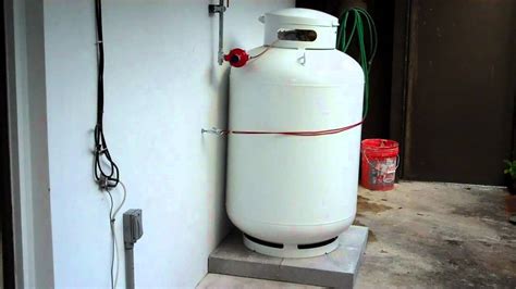 Propane tank and outdoor tankless water heater installation - YouTube