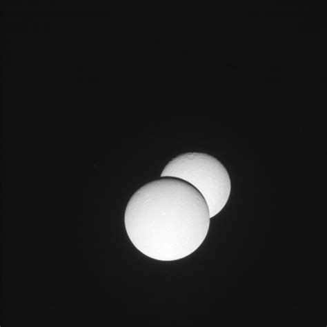 Unusual eclipse of Saturn's moon Rhea by Dione / Cassini-Huygens ...