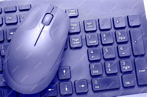 Premium Photo | The computer mouse and keyboard are purple. the ...