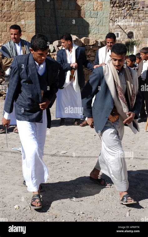 Two men dancing at wedding in Manakha, Yemen Stock Photo - Alamy