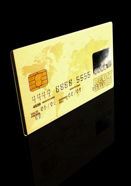 credit card over a black background - note the design of the card is my own and the numbers on ...