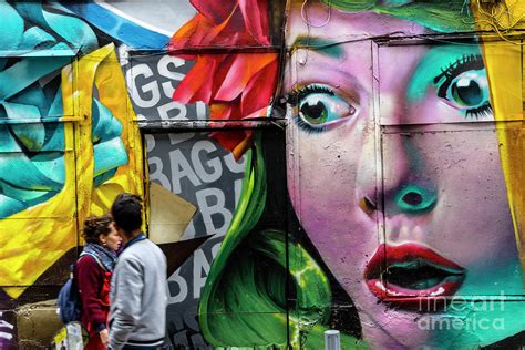 People Walking Past Graffiti Face Photograph by Tim Bird - Fine Art America