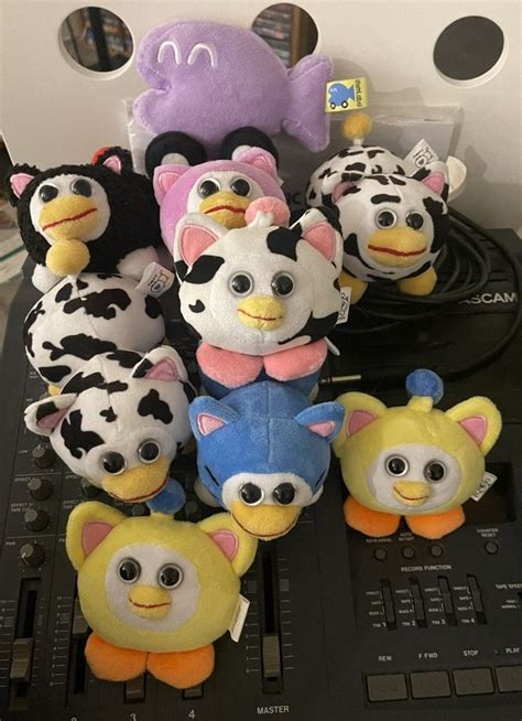 there are many stuffed animals on top of the electronic equipment that is connected to each other