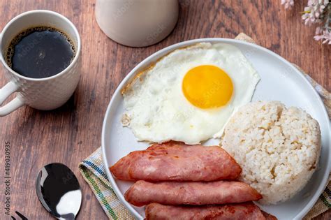 Hamsilog (flatlay)- famous Filipino meal that consists of fried rice, egg and ham slices. Stock ...