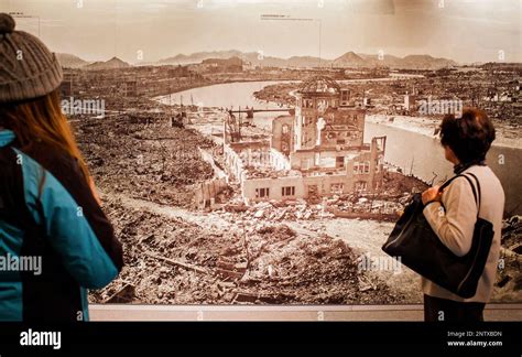 visitors looks a photo of Hiroshima after the atomic bomb explosion ...