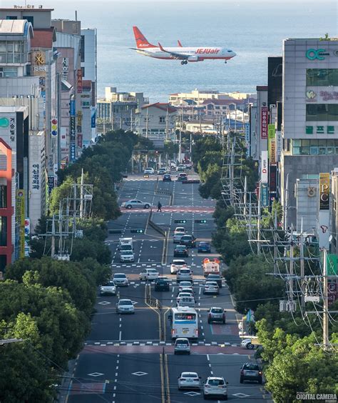 Plane heading towards Jeju International Airport seen from Wollang Road ...