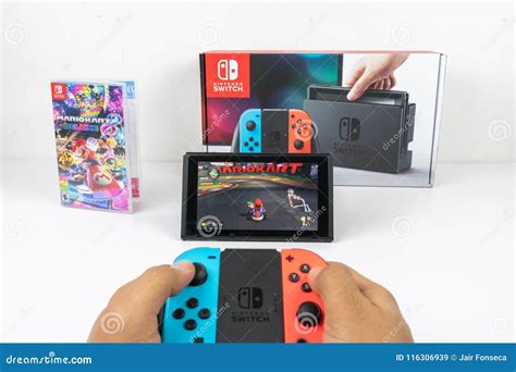 Playing Mario Kart Deluxe 8 in Nintendo Switch Editorial Stock Image ...