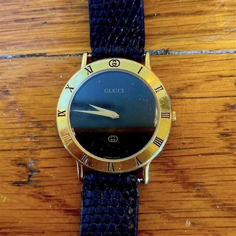 Vintage Gucci watch with a black leather band.... - Depop