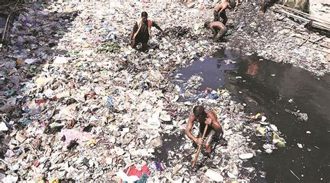 Mumbai pre-monsoon drain clean-up: ‘The smell of the nullah never leaves us, we swim in it ...