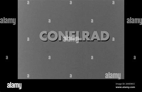 1950s: Caption "CONELRAD" flashes on screen. Drawing of woman with radio Stock Video Footage - Alamy