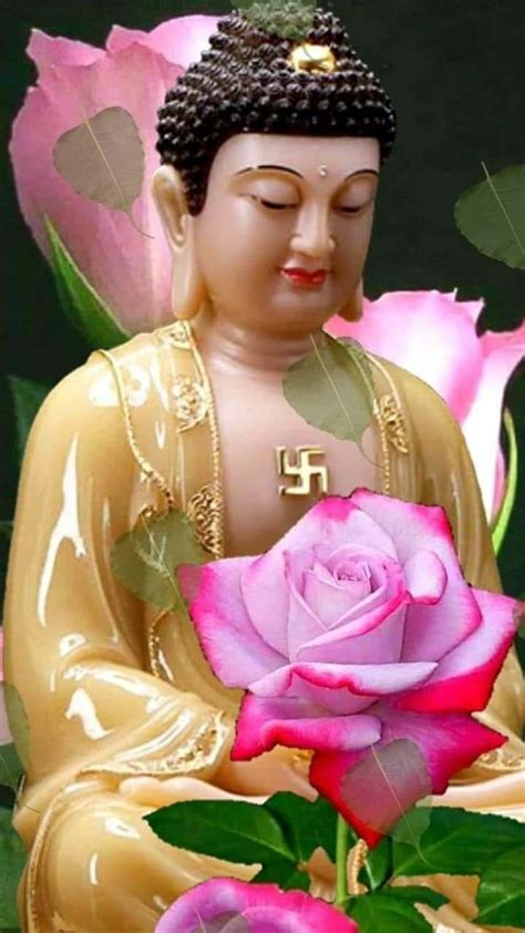 buddha statue with pink roses in front of it