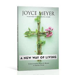 a new way of living book cover with pink flowers on the cross and green ...