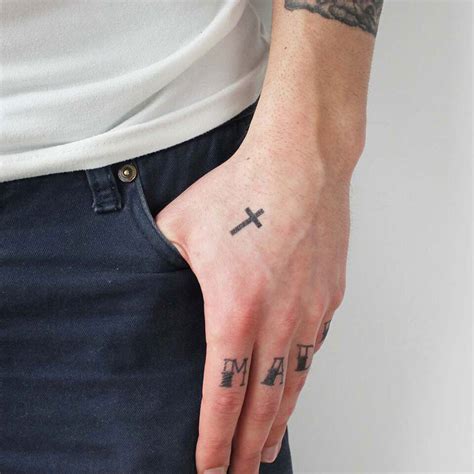 Share 77+ small cross hand tattoos - in.coedo.com.vn