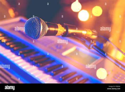 Microphone and piano keyboard on stage.Concert and musical instrument Stock Photo - Alamy
