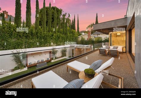 Outdoor patio with furniture and wooden deck Stock Photo - Alamy