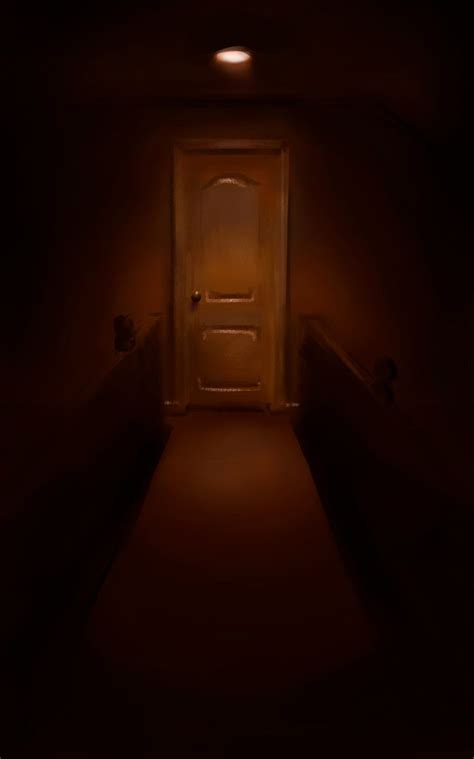 a dimly lit hallway leading to a door