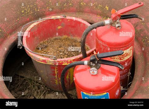 fire extinguishers sand bucket extinguisher emergency fires Stock Photo - Alamy