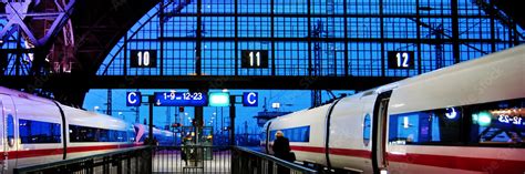 Leipzig train station at night with two speed trains about to leave ...