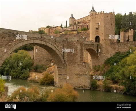 Medieval arch bridge on the Tagus River in Toledo City, Spain Stock Photo - Alamy