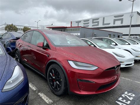 Tesla's new Ultra Red color side-by-side with old Multicoat