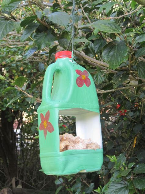 Milk bottle bird feeder | Bird feeder craft, Nature crafts, Crafts