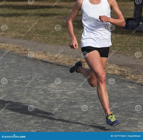 Female Cross Country Runner Racing on a Gravel Path Stock Image - Image ...