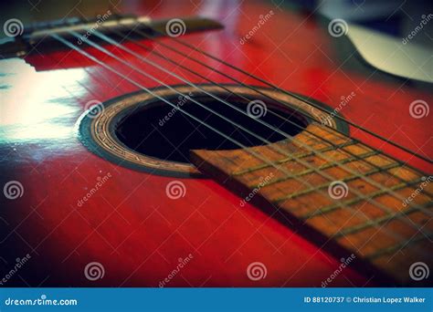 Red acoustic guitar stock image. Image of table, chords - 88120737