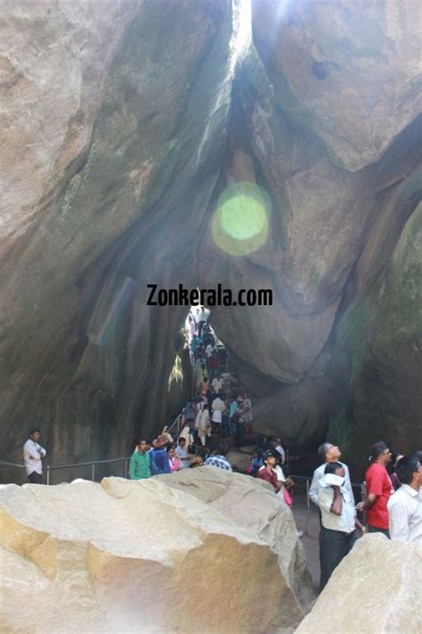 People view through the huge rocks of edakkal caves 111